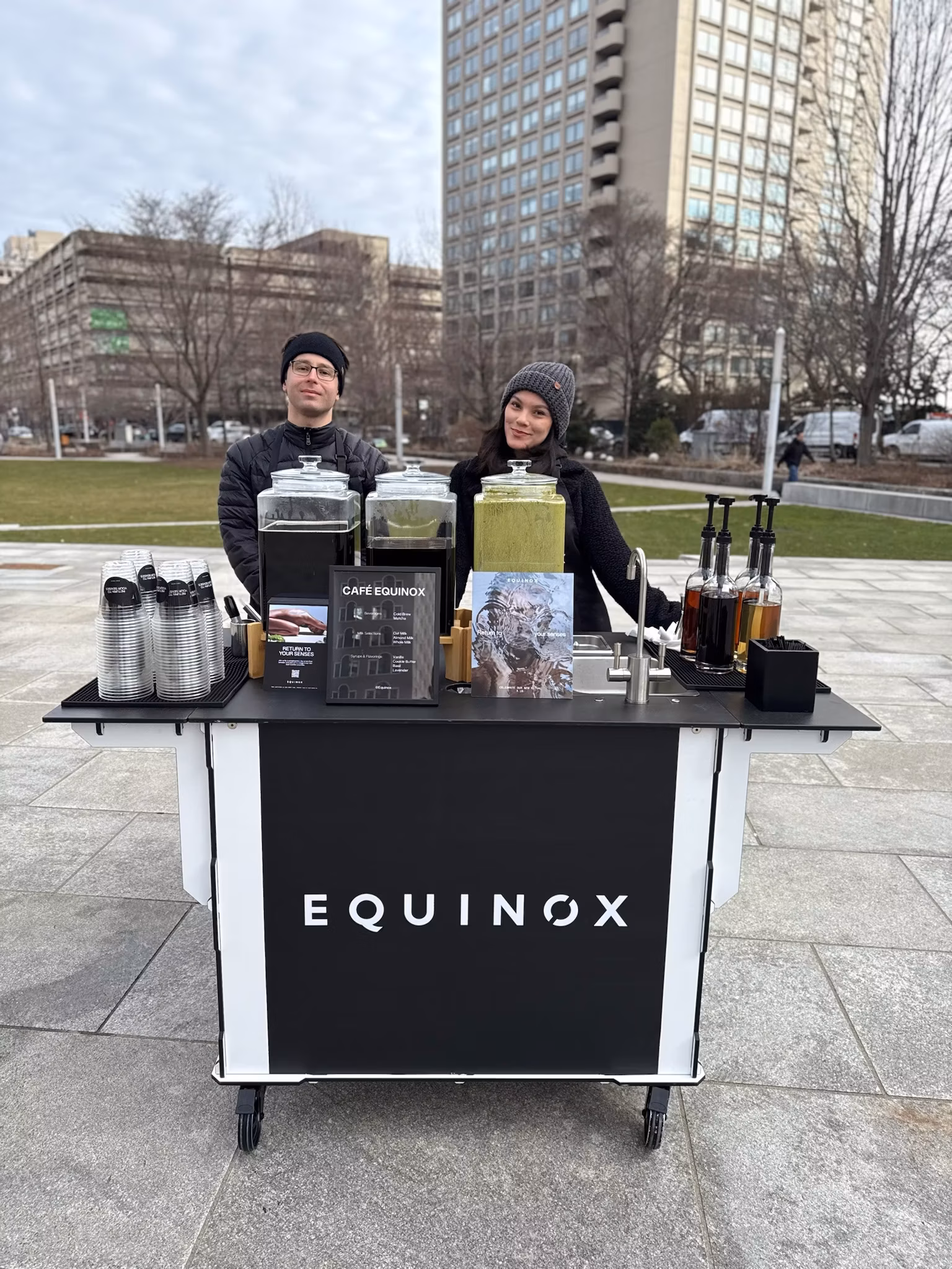 Group of people with branded coffee cart