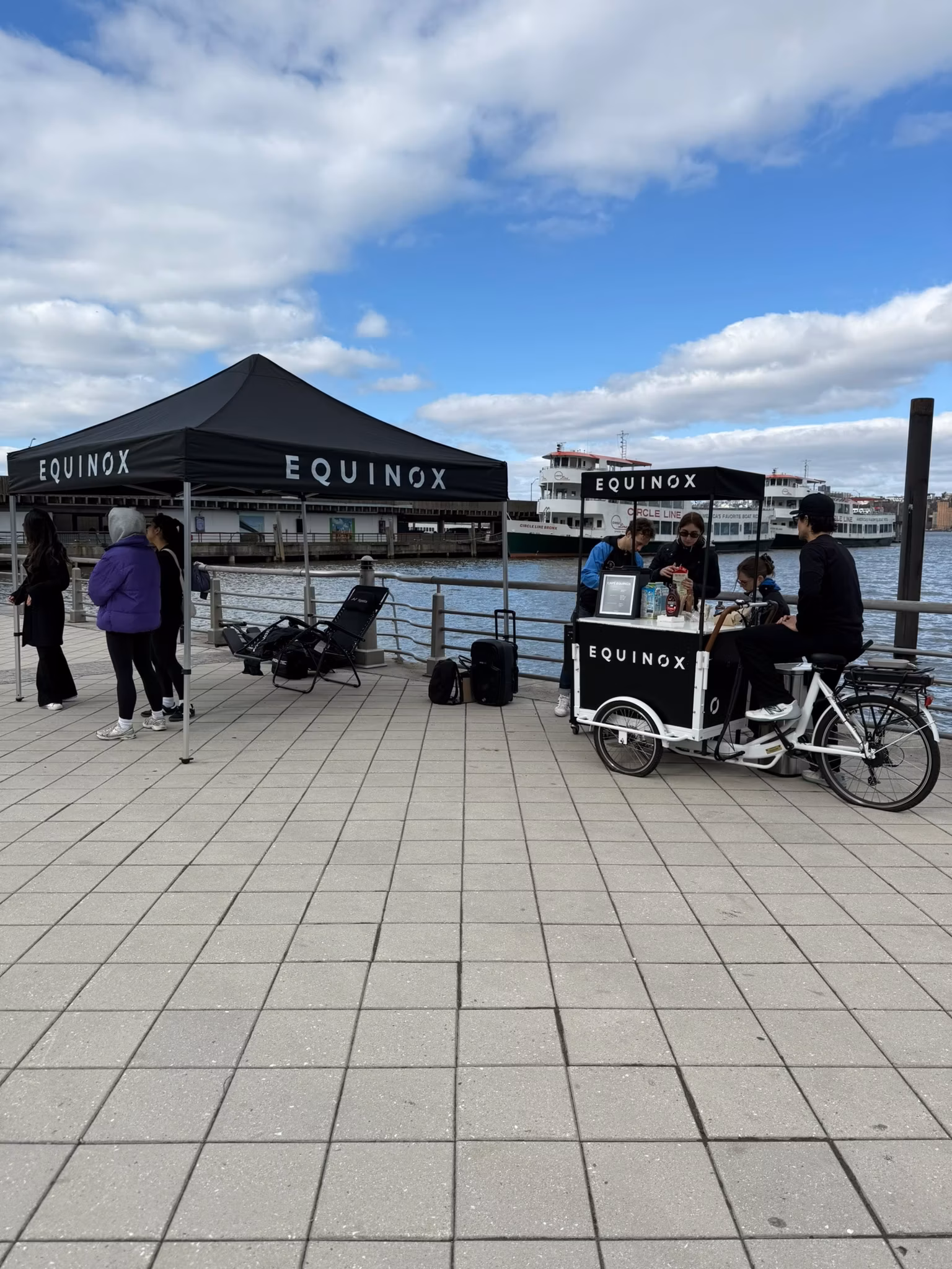 Branded coffee cart tent and table at a marketing event