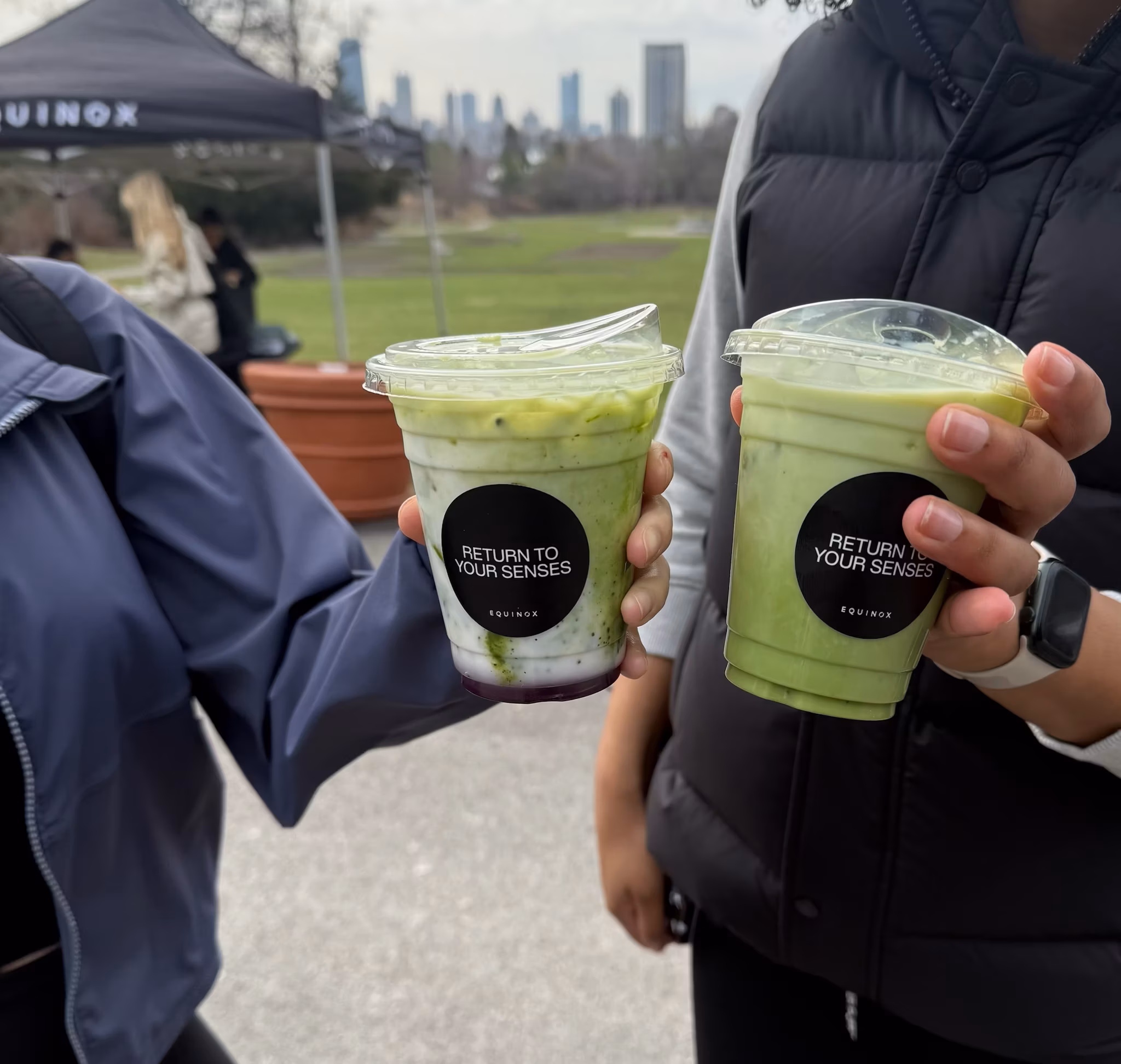Two matcha drinks from a branded coffee cart