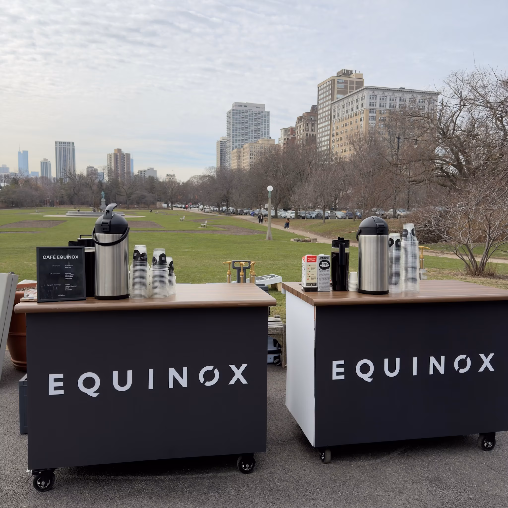 Double branded coffee cart tables at an activation
